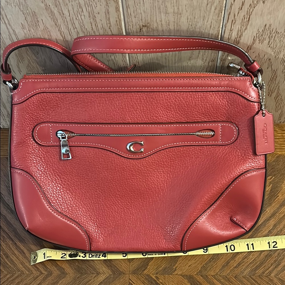 Coach Red Leather Shoulder/crossbody bag.  It is not a bright red.  EUC